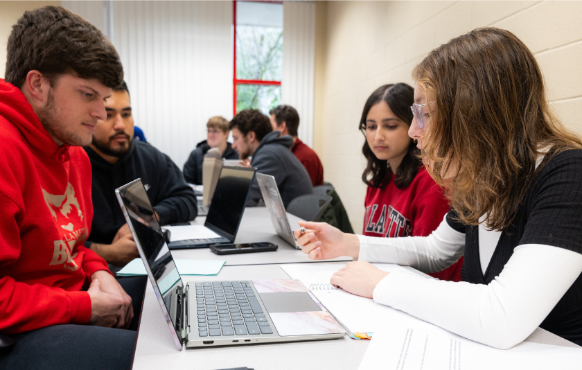 A group of Willamette University students studying in a classroom. 