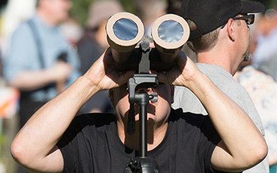 person looking at total solar eclipse Willamette University