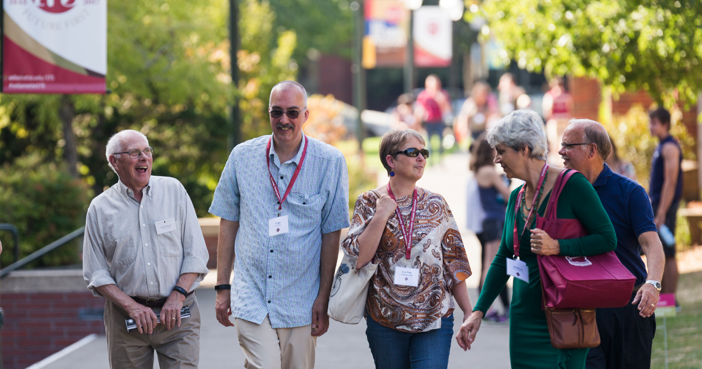 alumni walking on Willamette campus