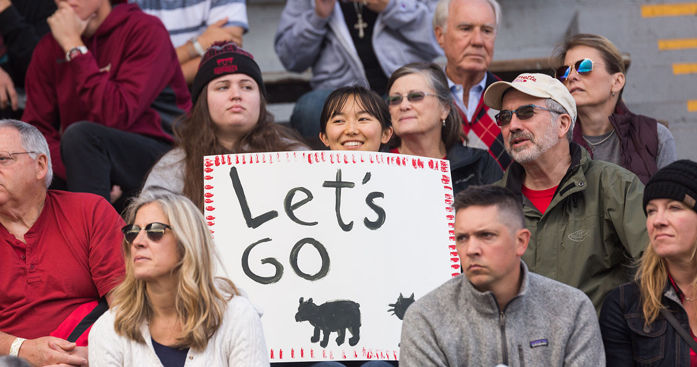 Fans cheer on the Bearcat football team