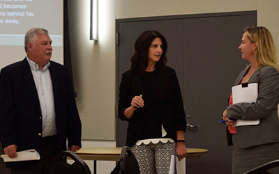 Erin Greenawald JD'98 (middle), domestic violence resource prosecutor for the Oregon Department of Justice, conducts a training on domestic and sexual violence at the Sexual Assault Training Institute. Pictured with her is Steve Bellshaw, deputy chief of the Salem Police Department, and Jodie Bureta JD'03, former Marion County District Attorney's Office prosecutor and now an employee of the Department of Justice. 