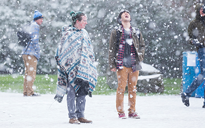 Students playing in the snow