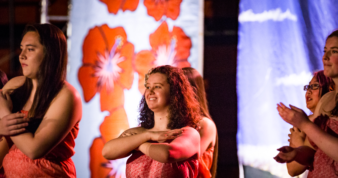 women with arms crossed at the luau