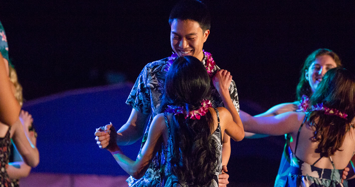 a man and woman dance together