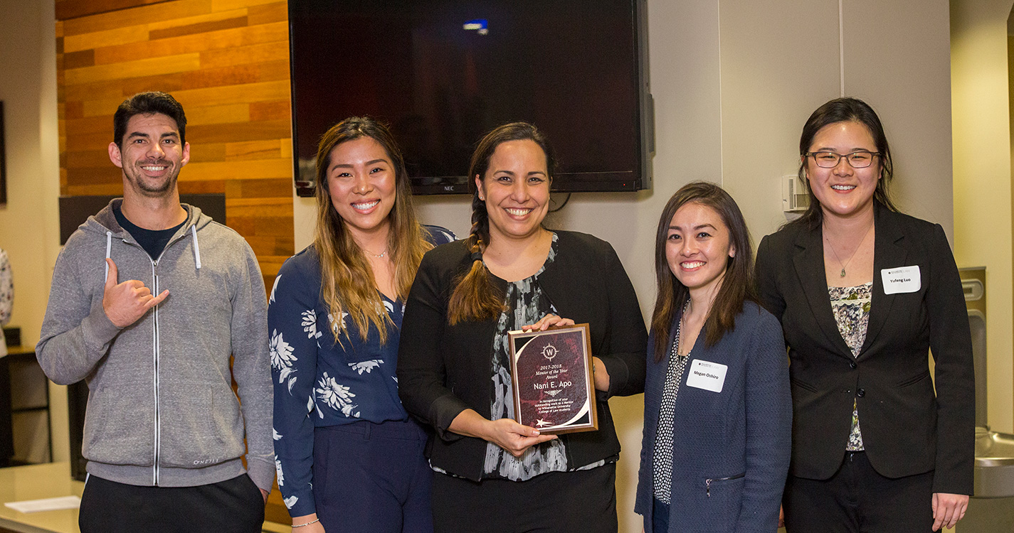 Nani Apo JD’13, center, stands next to the students who nominated her for Mentor of the Year. 