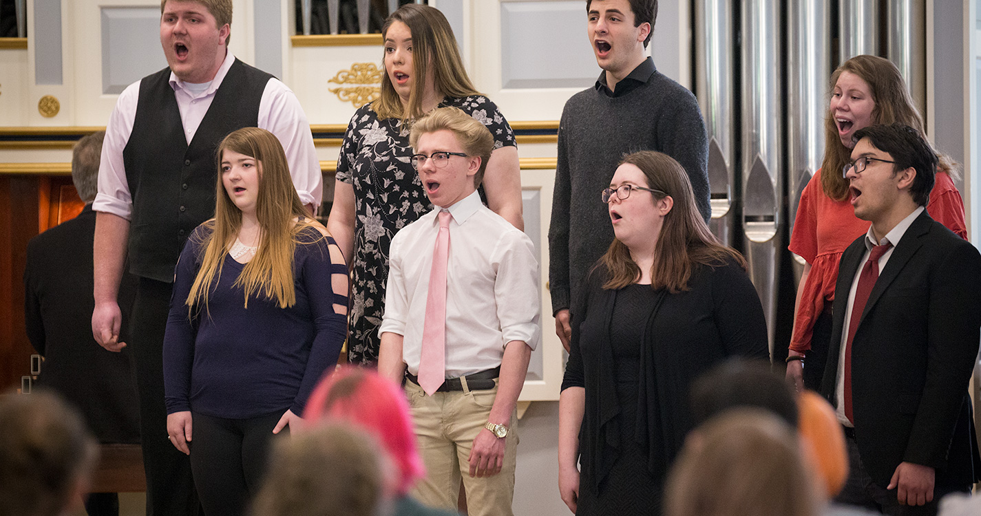 a choir of students sing at Student Scholarship Recognition Day. 