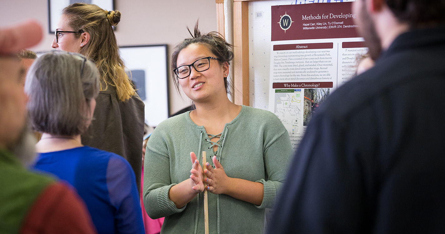 A student presents a poster at Student Scholarship Recognition Day. 