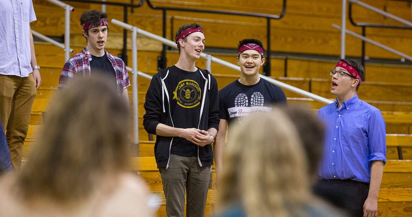 A quartet of students sing.