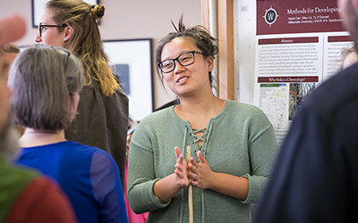 a student presents a poster at SSRD