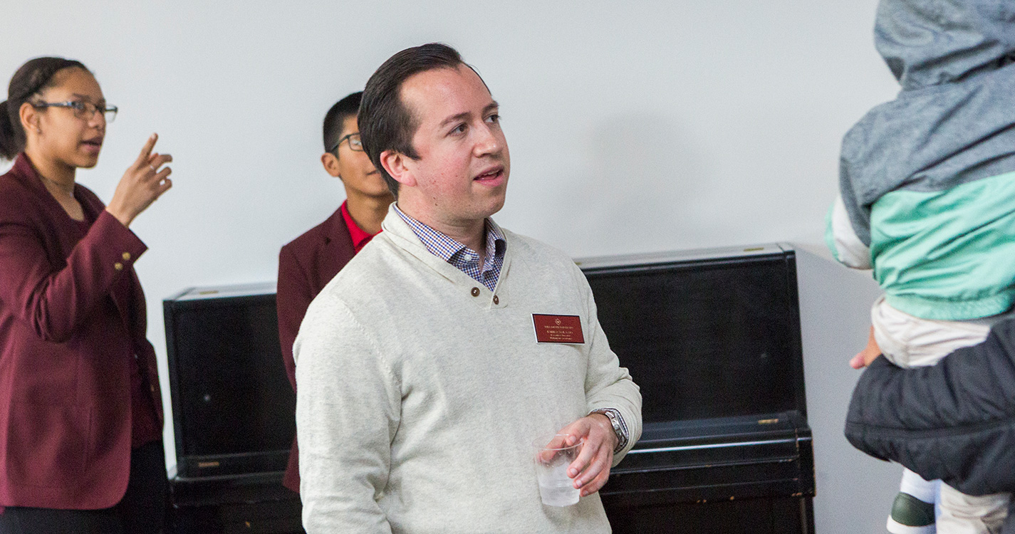 Willamette Academy Executive Director Emilio Solano speaks at the academy open house