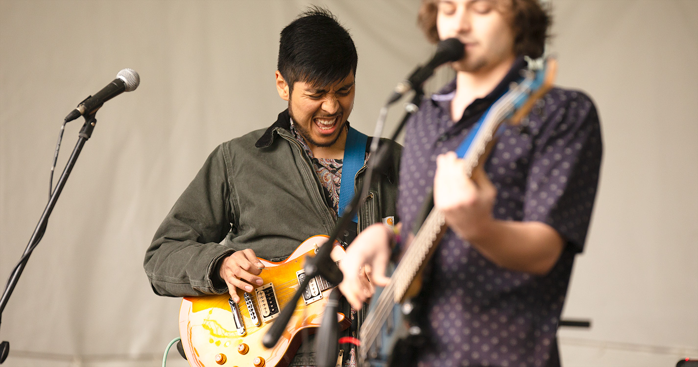 A band plays and sings onstage at Wulapalooza.