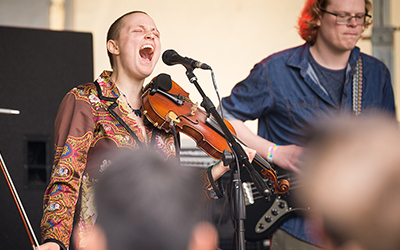 A violinist sings at Wulapalooza