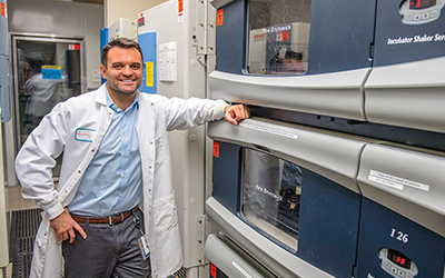 Bioscientist Travis Stiles ’05 stands in his lab