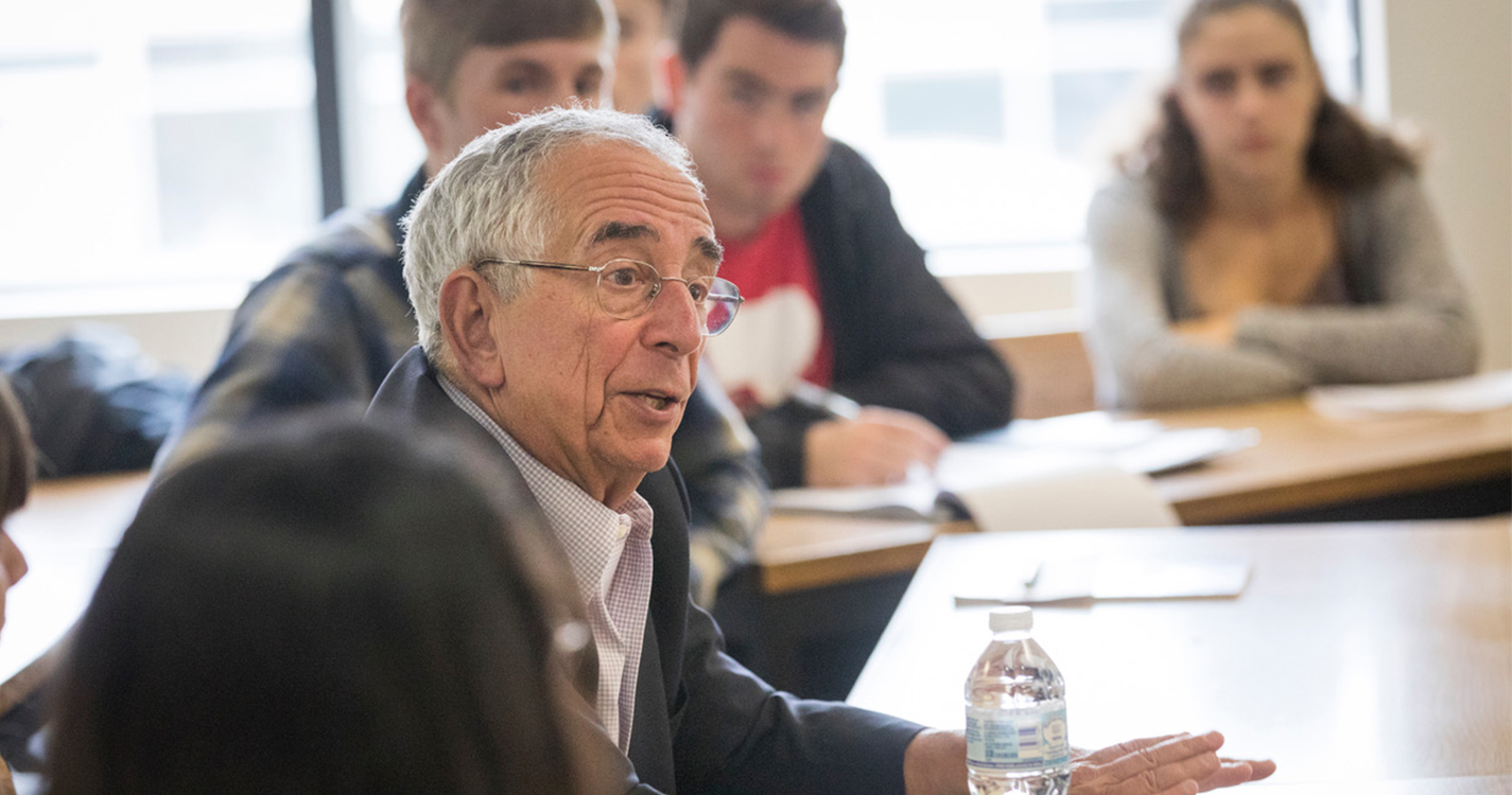 Convocation speaker Barry Schwartz addresses a classroom of new students.