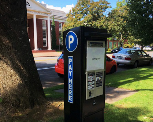 electronic parking station on Winter Street with College of Law in background