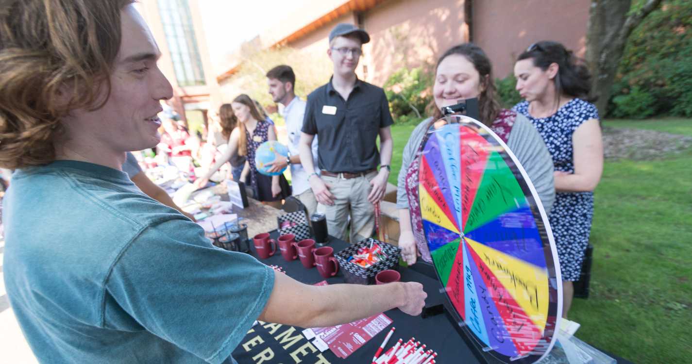 student spins a colorful prize wheel