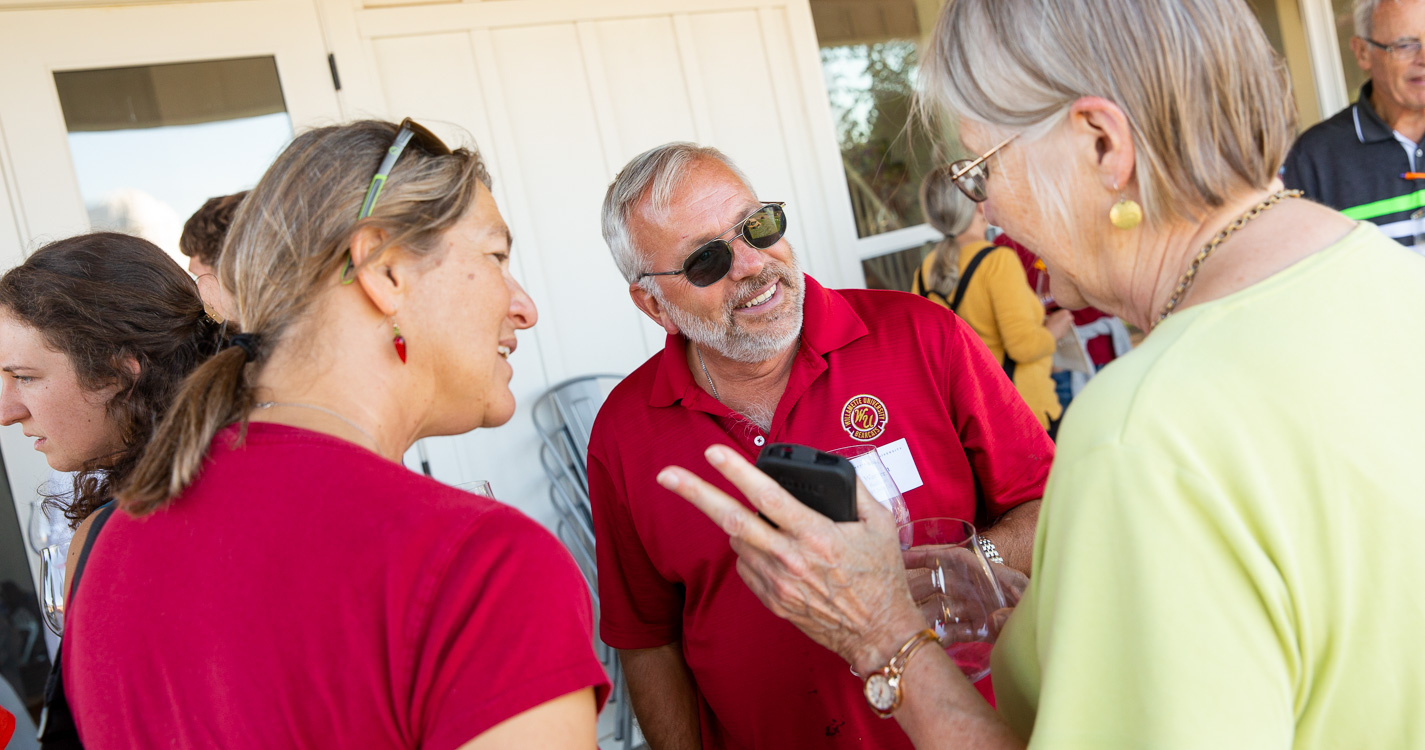 three people having a conversation