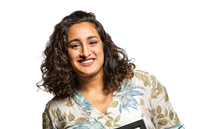 Amarit Ubhi ’20 holds photo of self with Gov. Kate Brown