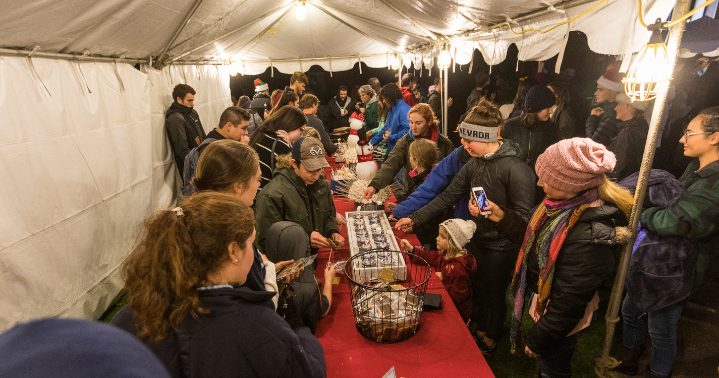 Guests line up for s'mores. 