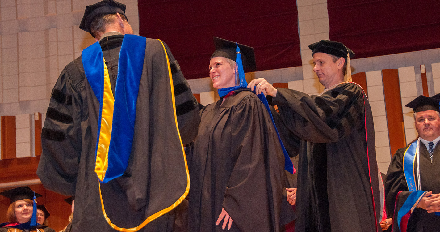 Graduate being hooded