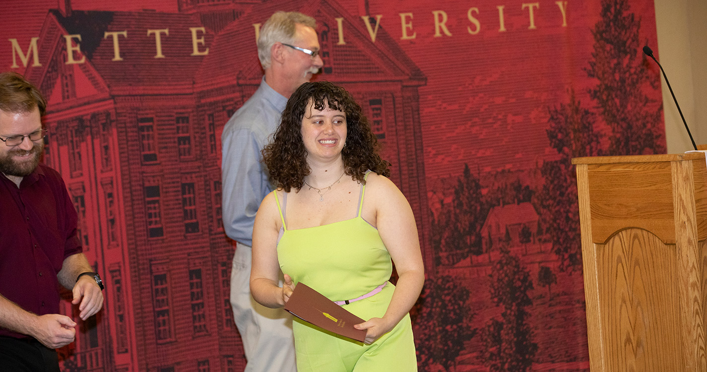 Samantha Levy ’20 stands with award