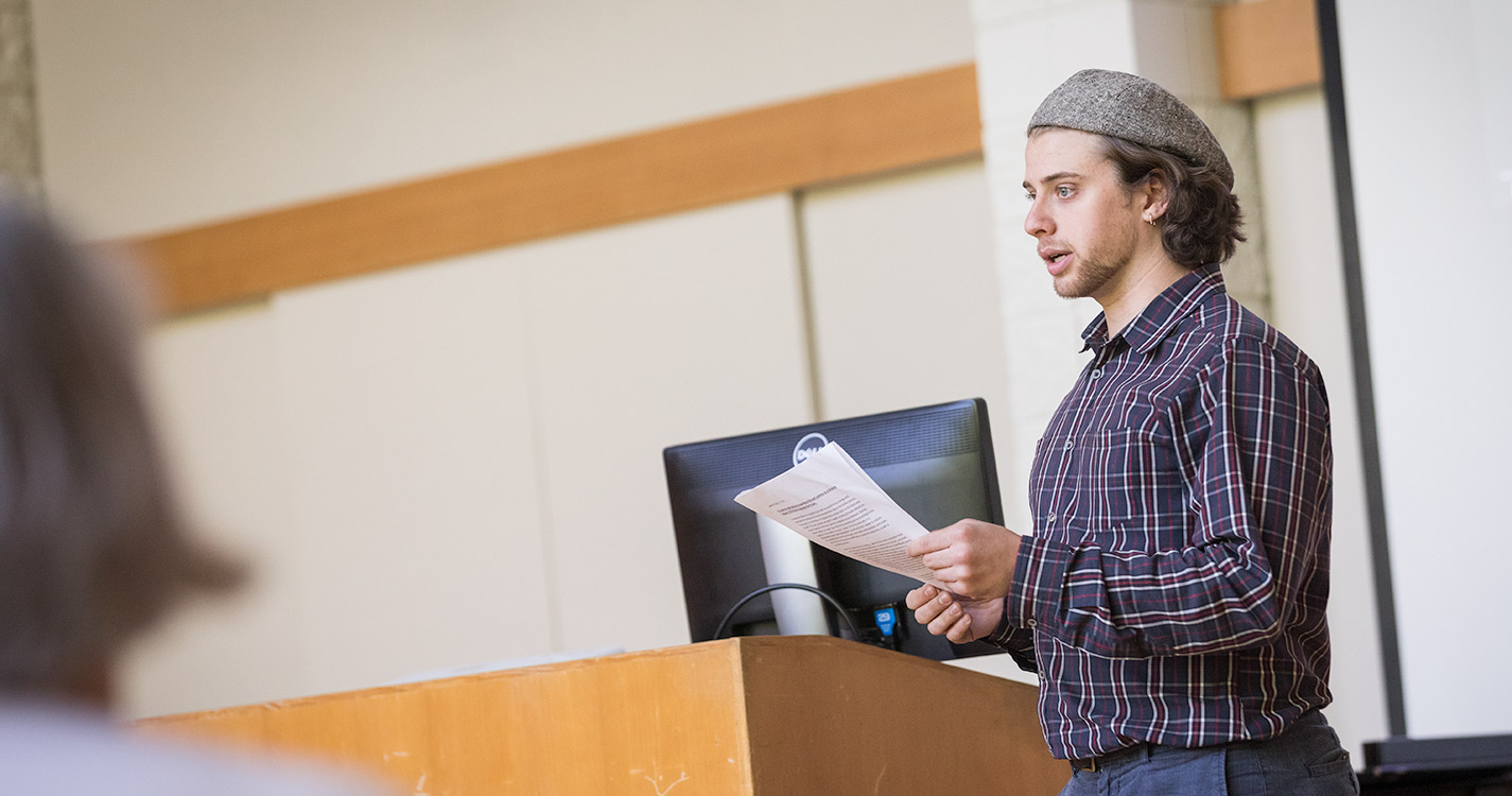 Student speaks from a podium 