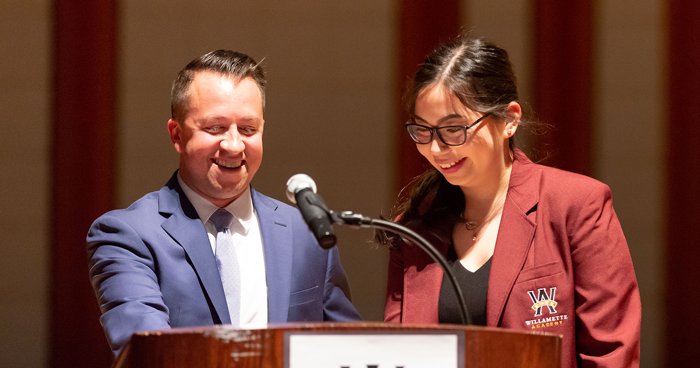 Two speakers at a podium