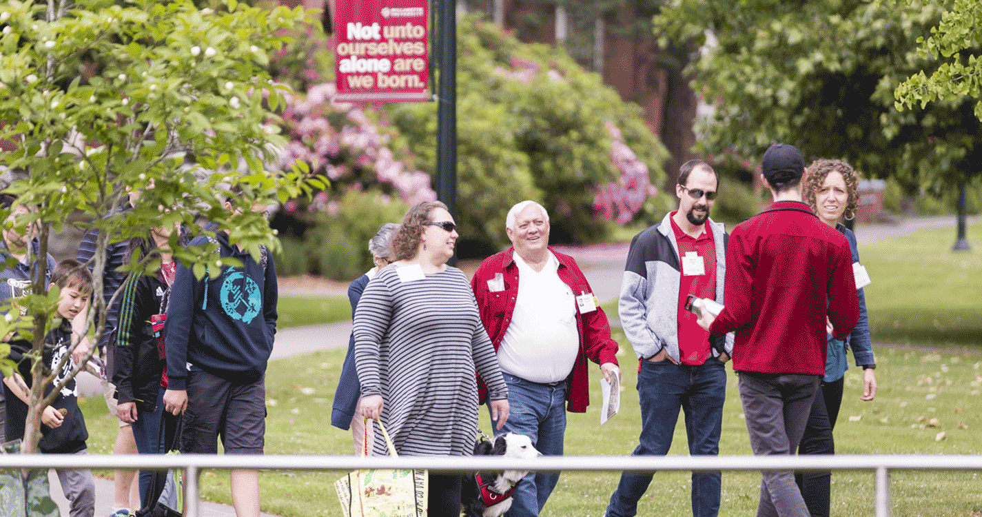 Student leads a group on a tour of campus