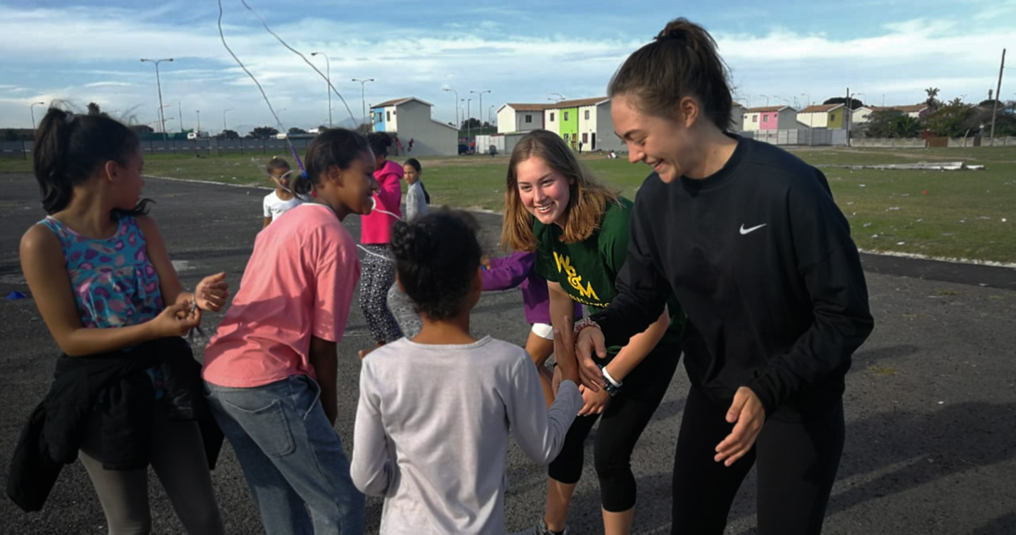 Scott playing sports with neighborhood children.