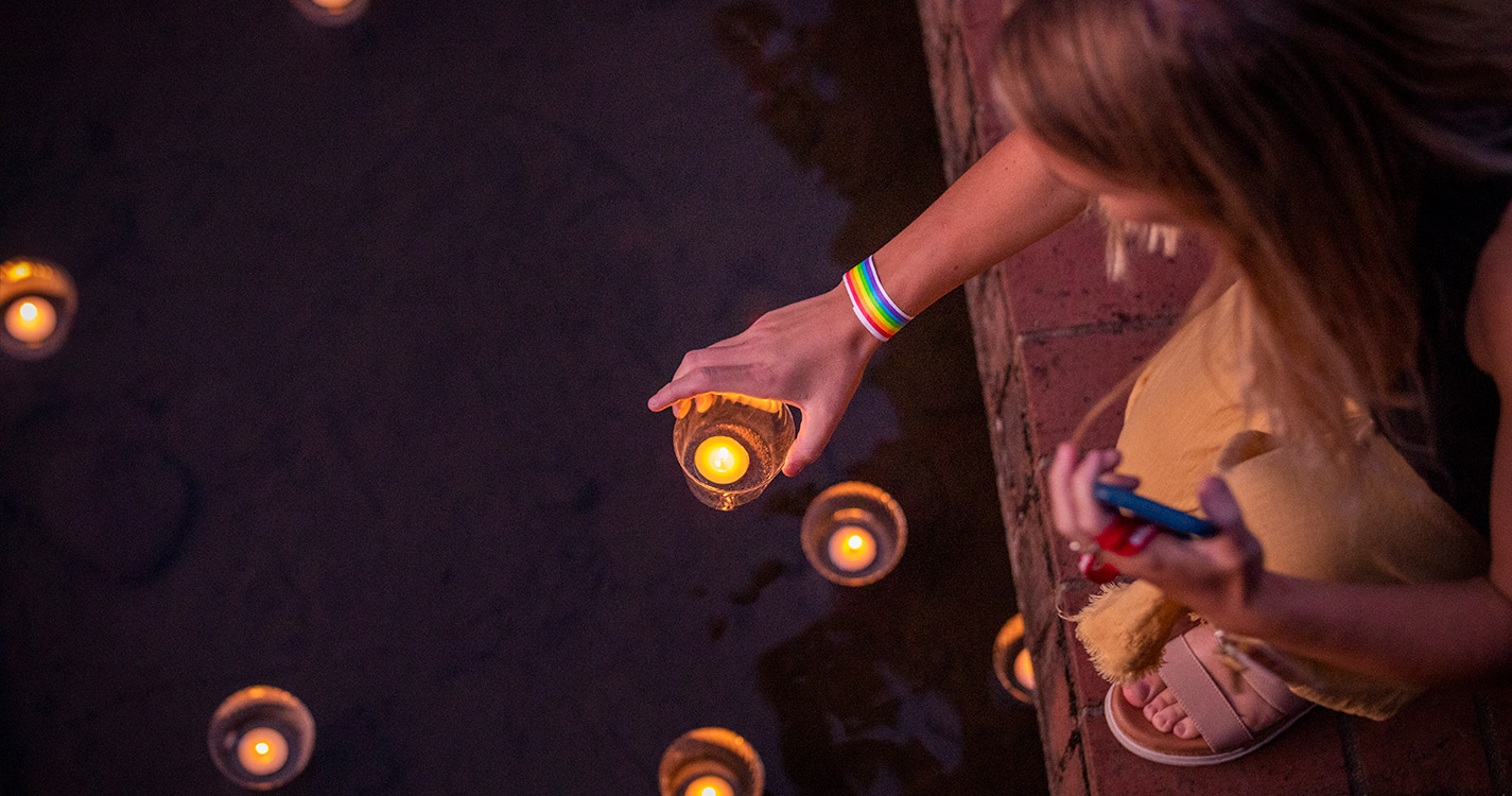 Student floating candle on water 