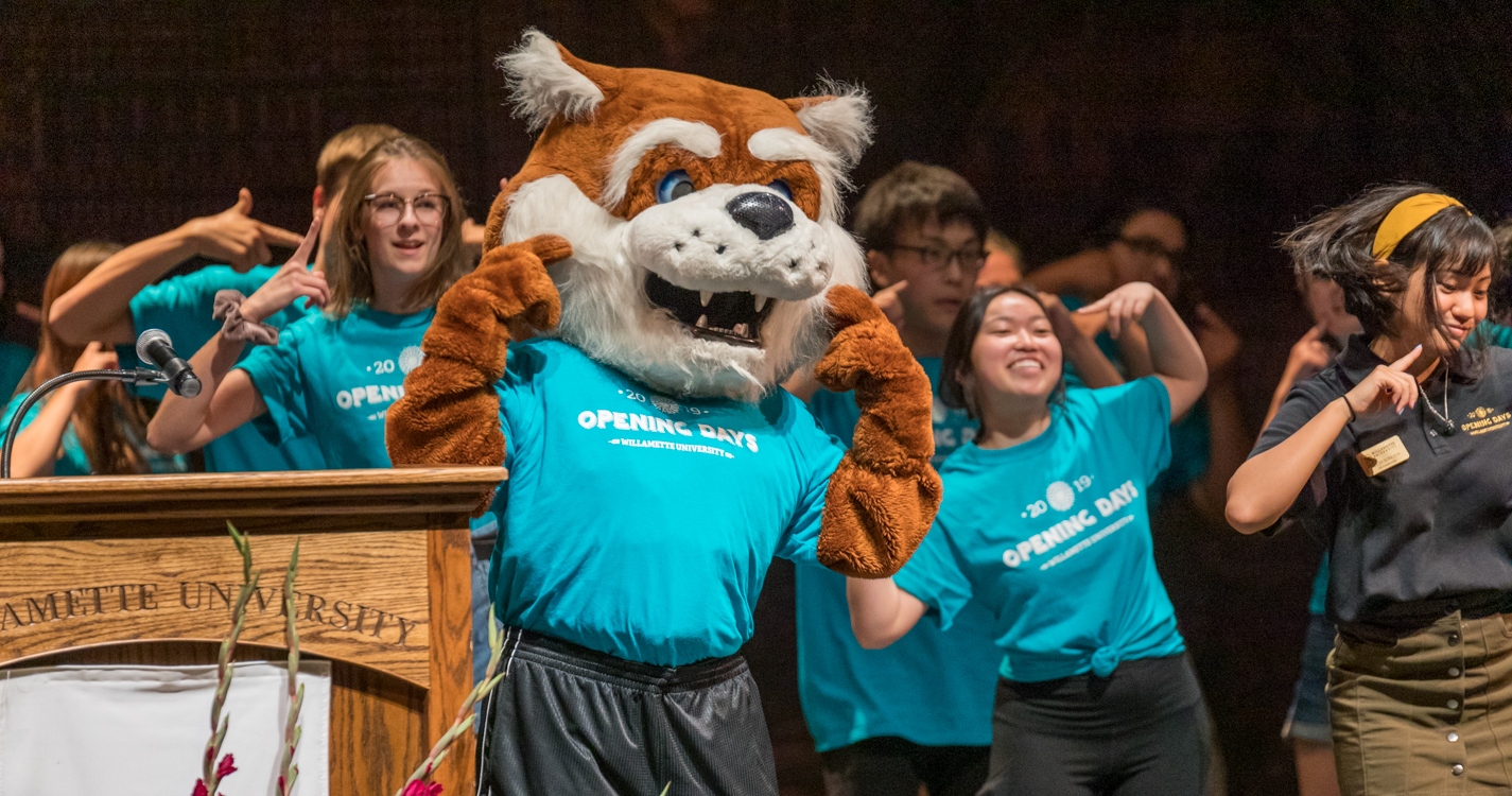 Blitz the Bearcat and the Opening Days team dressed in blue shirts strike a happy pose during a dance