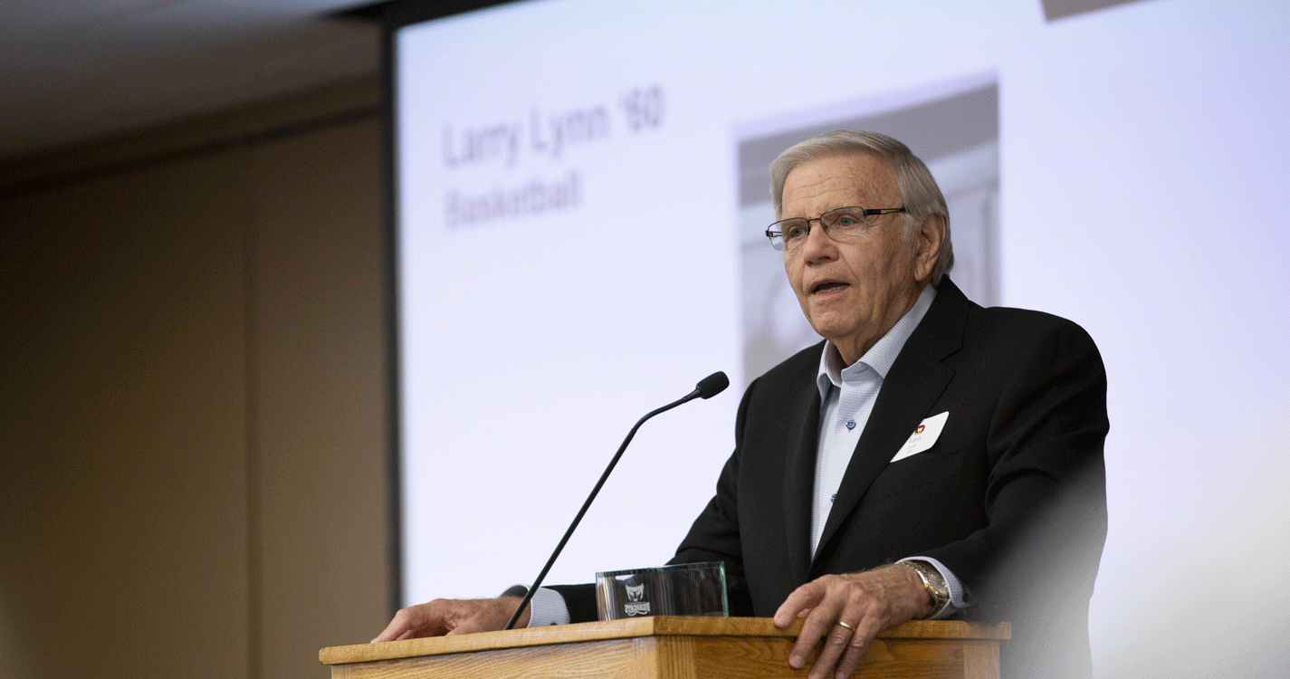 A speaker introduces a hall of fame winner