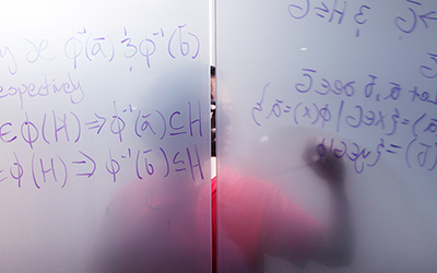 Teacher drawing on white board 