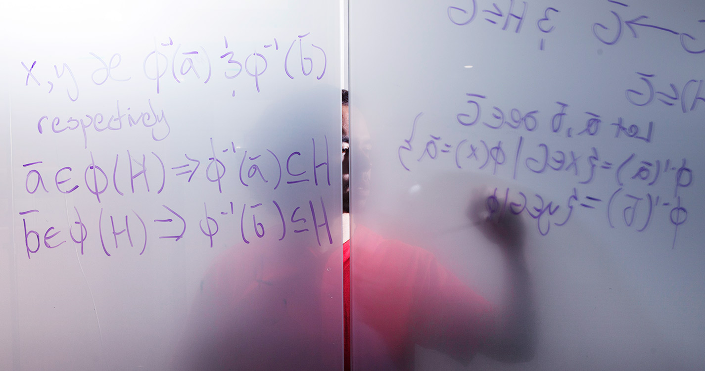 Teacher drawing on white board