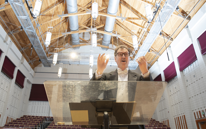 wallace long conducts the choir