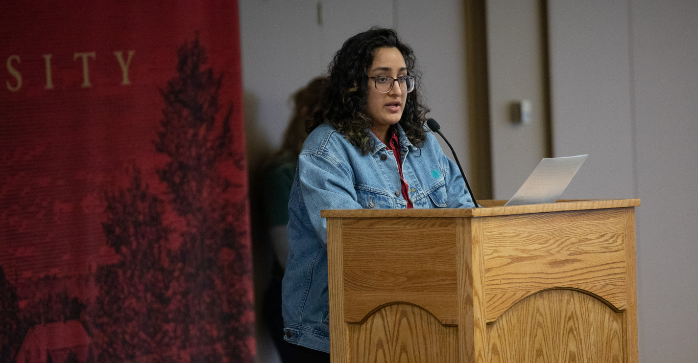 ASWU president Amarit Ubhi speaks at a podium