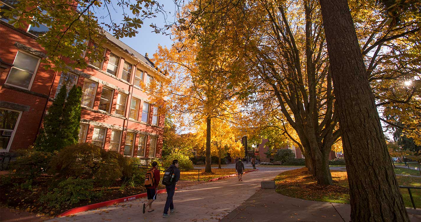 students walking by eaton hall