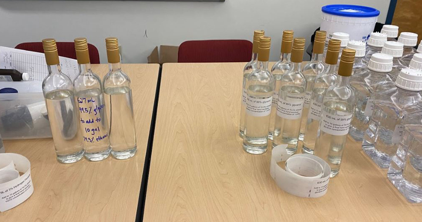 bottles of prepared and measured ingredients for sanitizer