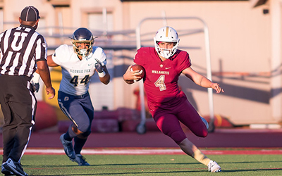 Football player makes a cut with the ball