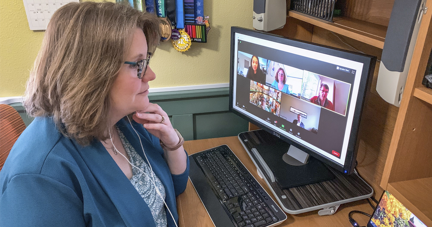 Associate Dean Melodye Mac Alpine meets via zoom with law school leadership and staff (Photo credit: Chip Mac Alpine)