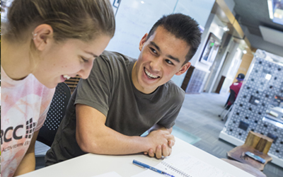 Two undergraduate students at a table in Ford Hall