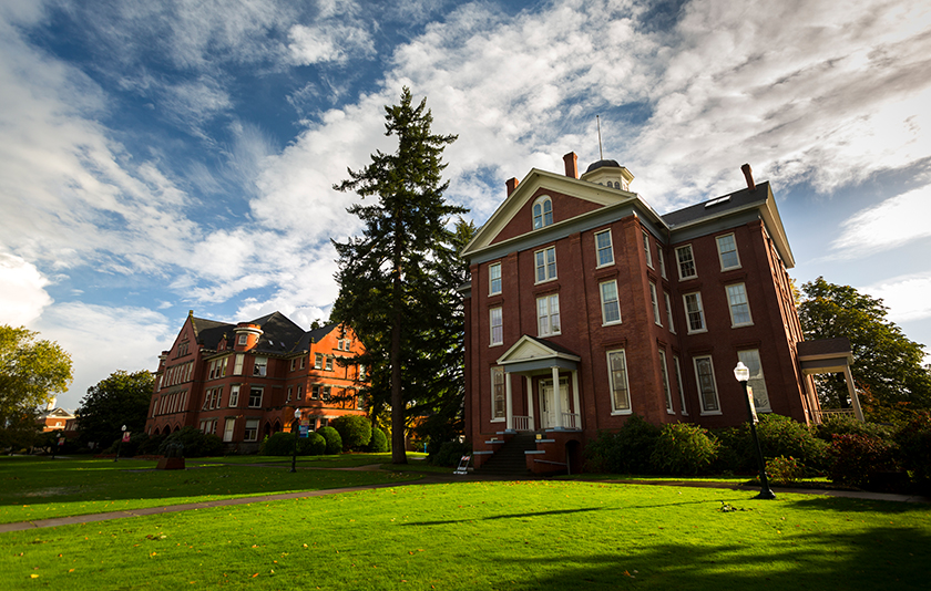 Waller Hall on a sunny day with green grass