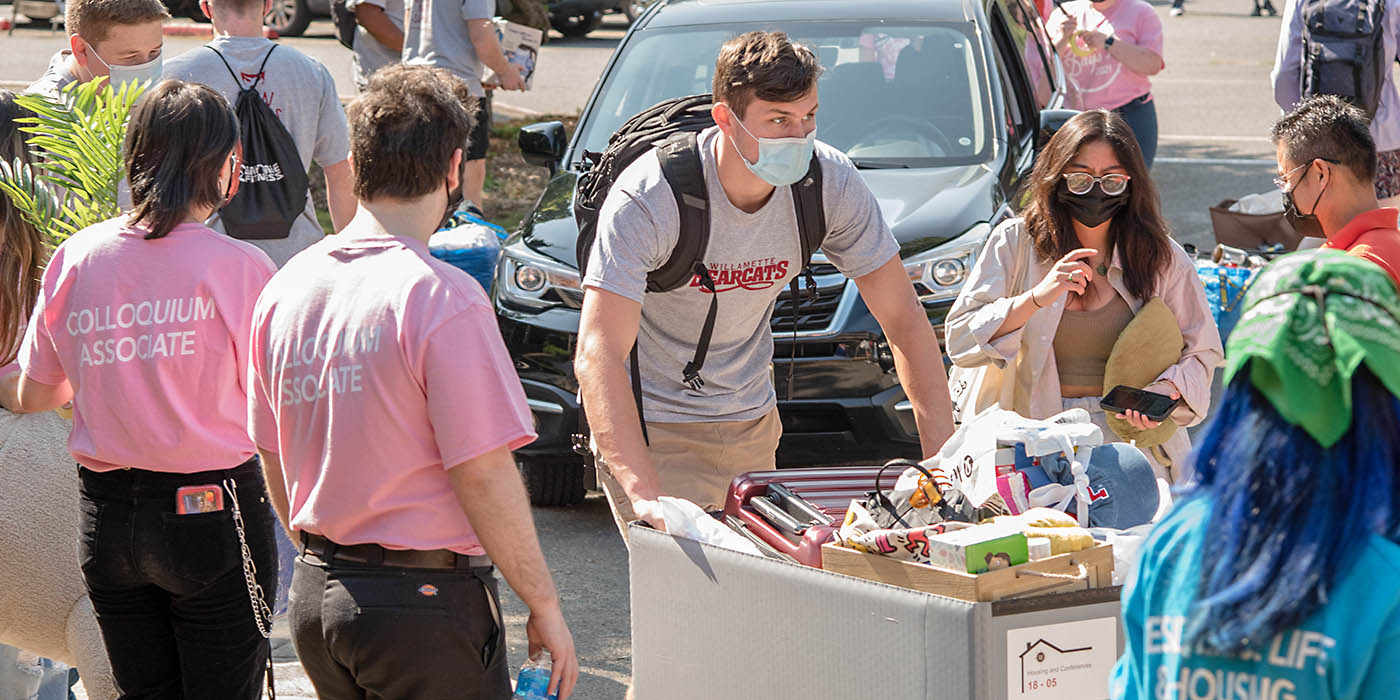 Campus volunteers and student athletes helping with the heavy lifting of move-in day.