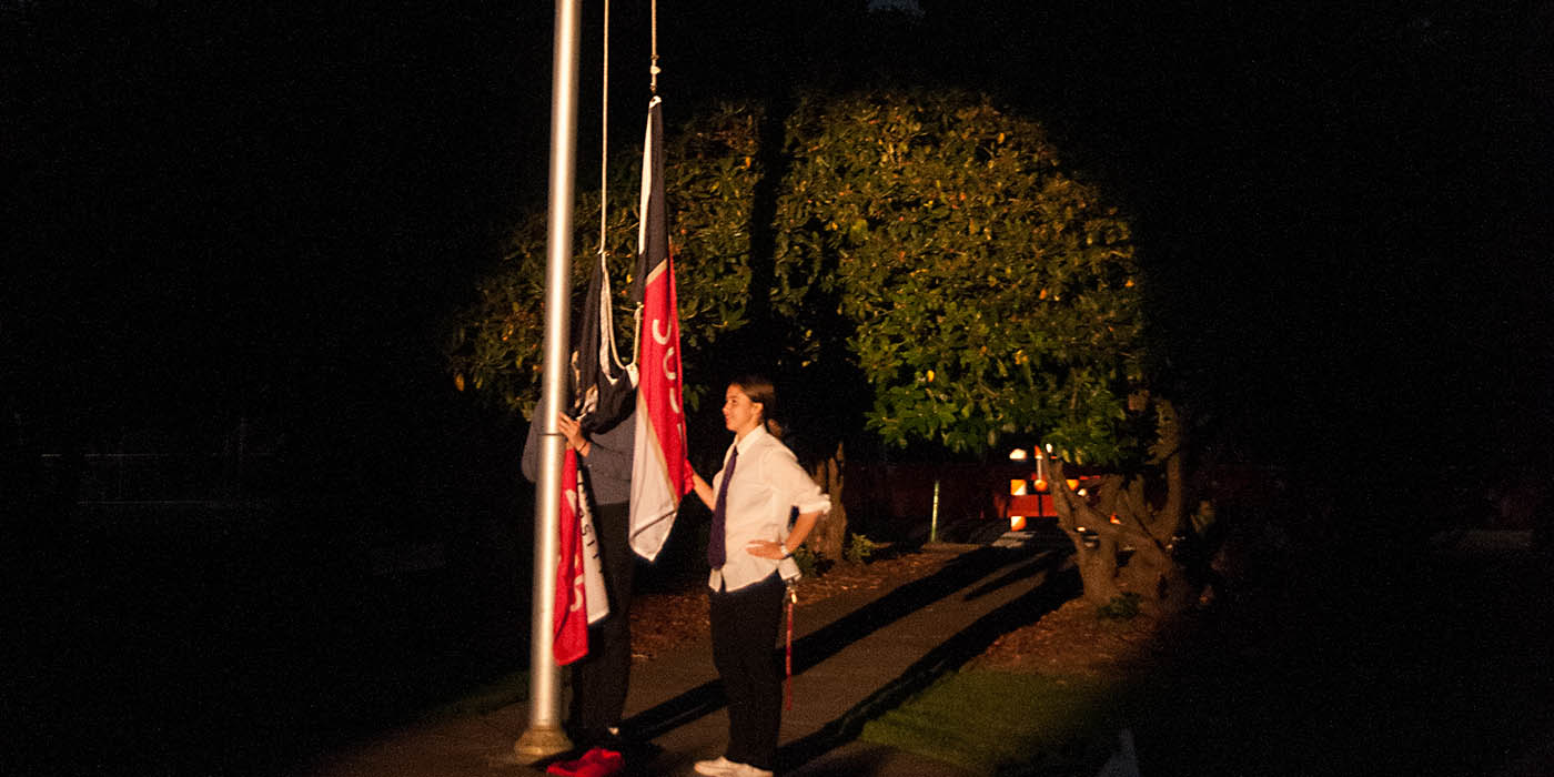 Students raising the matriculation flag.