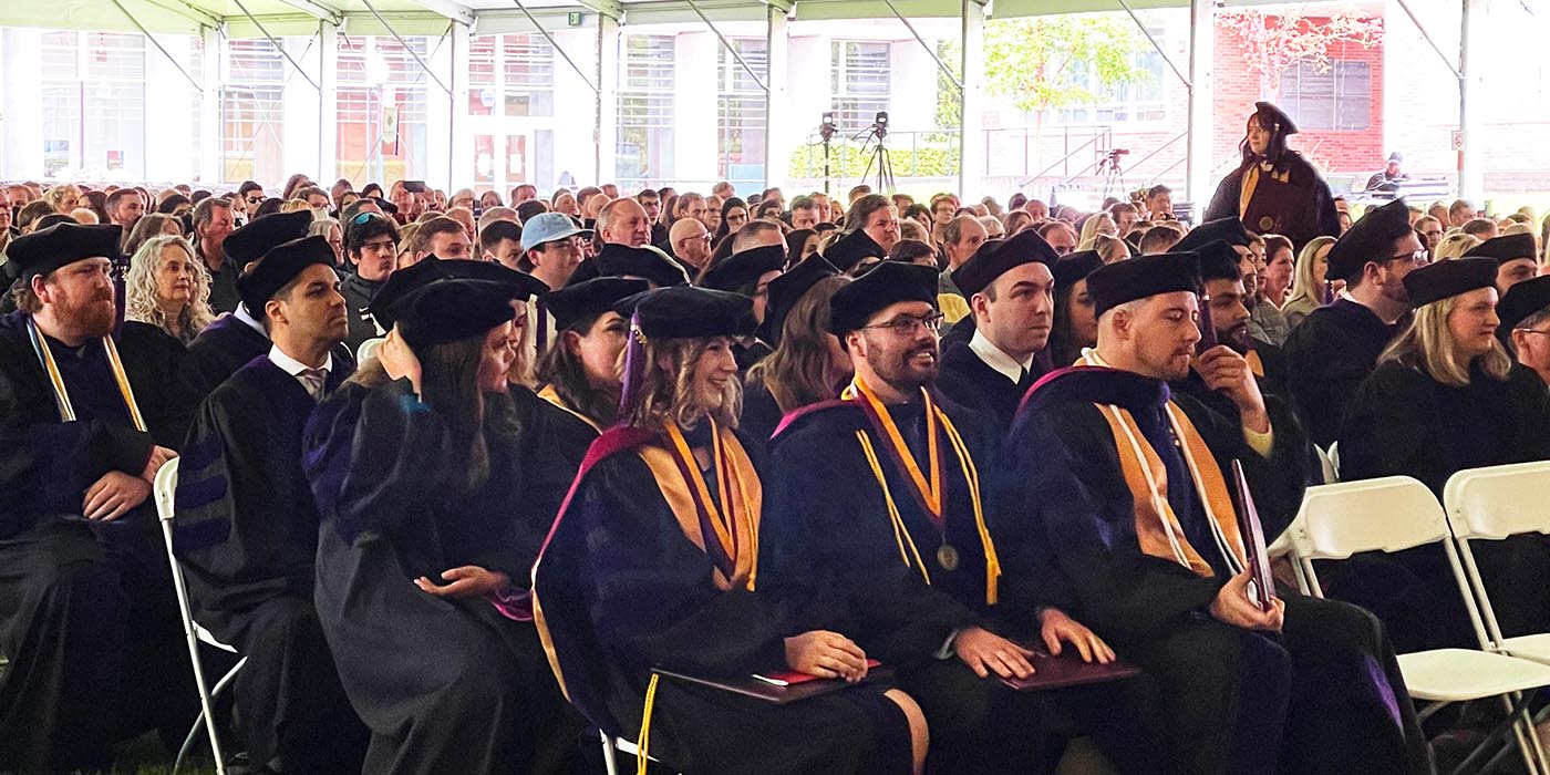 law grads under tent