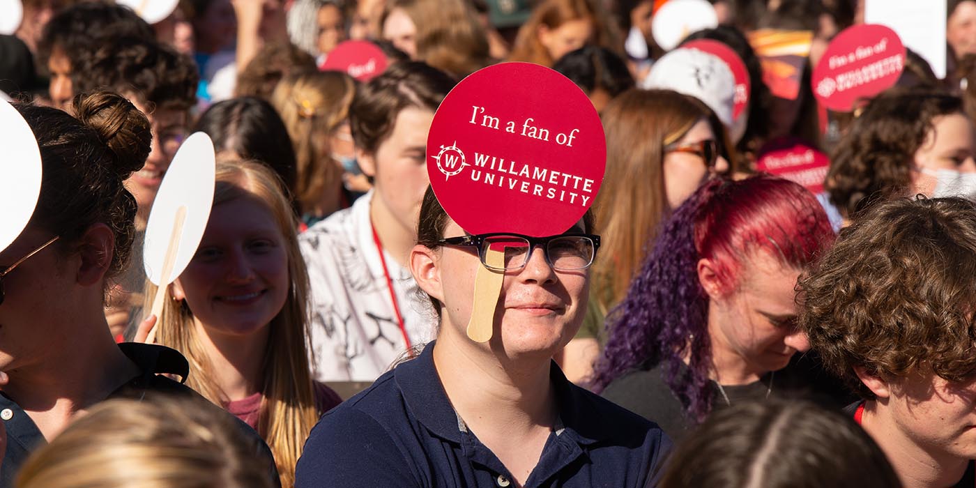 Student with WU logo fan