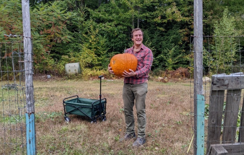 Garrison Holding a pumpkin