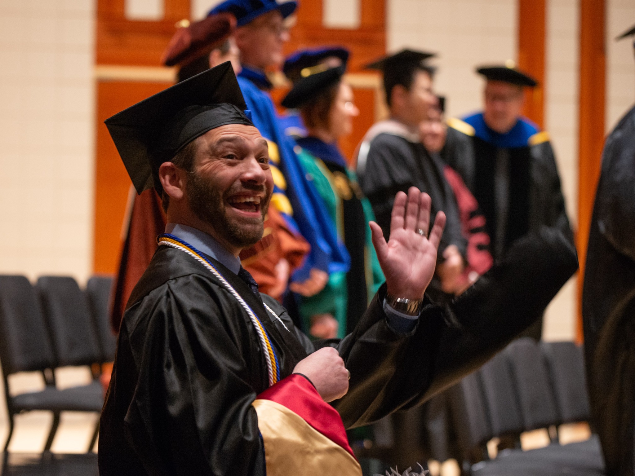 Student waving