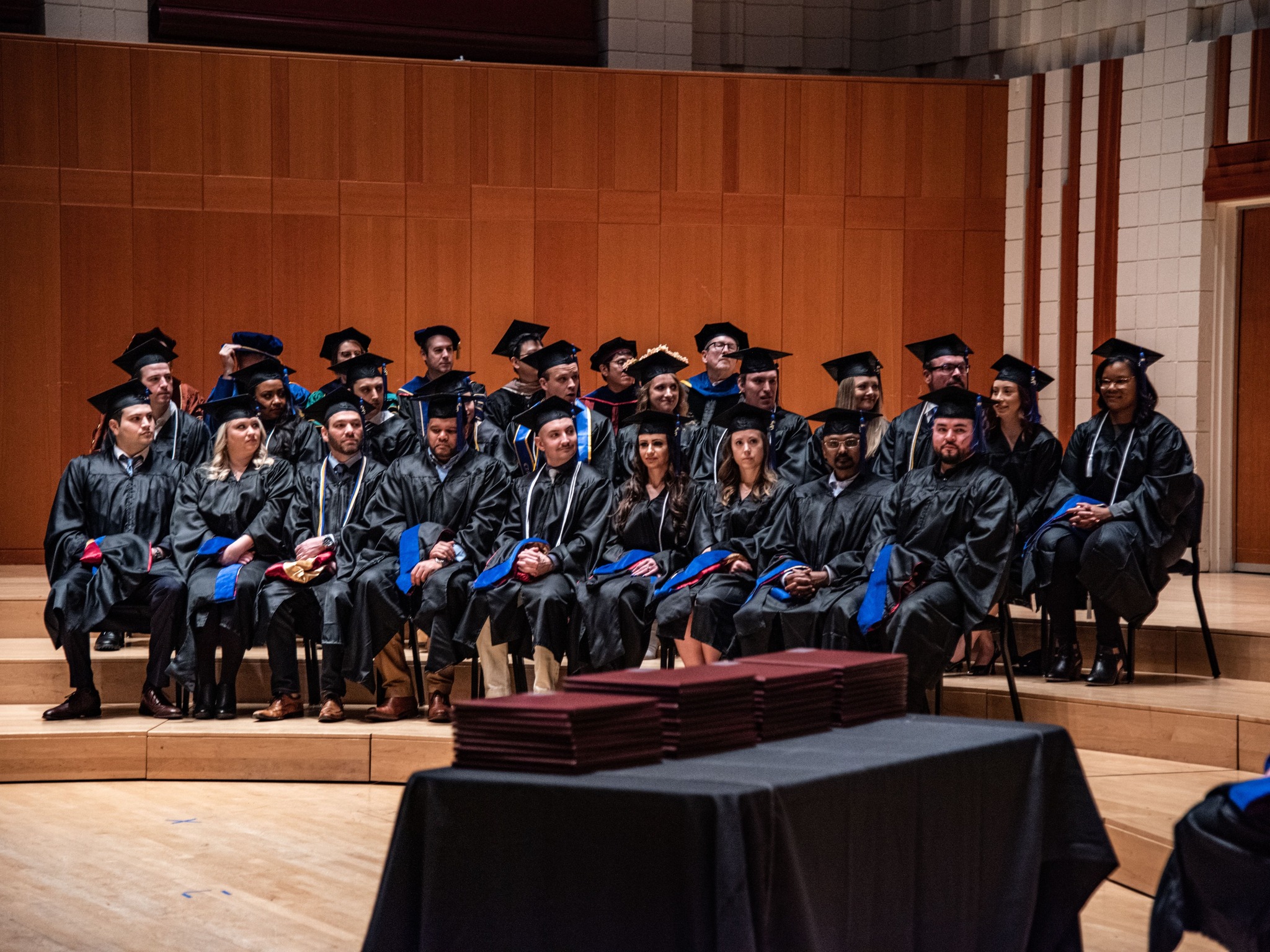 group of graduates on chair