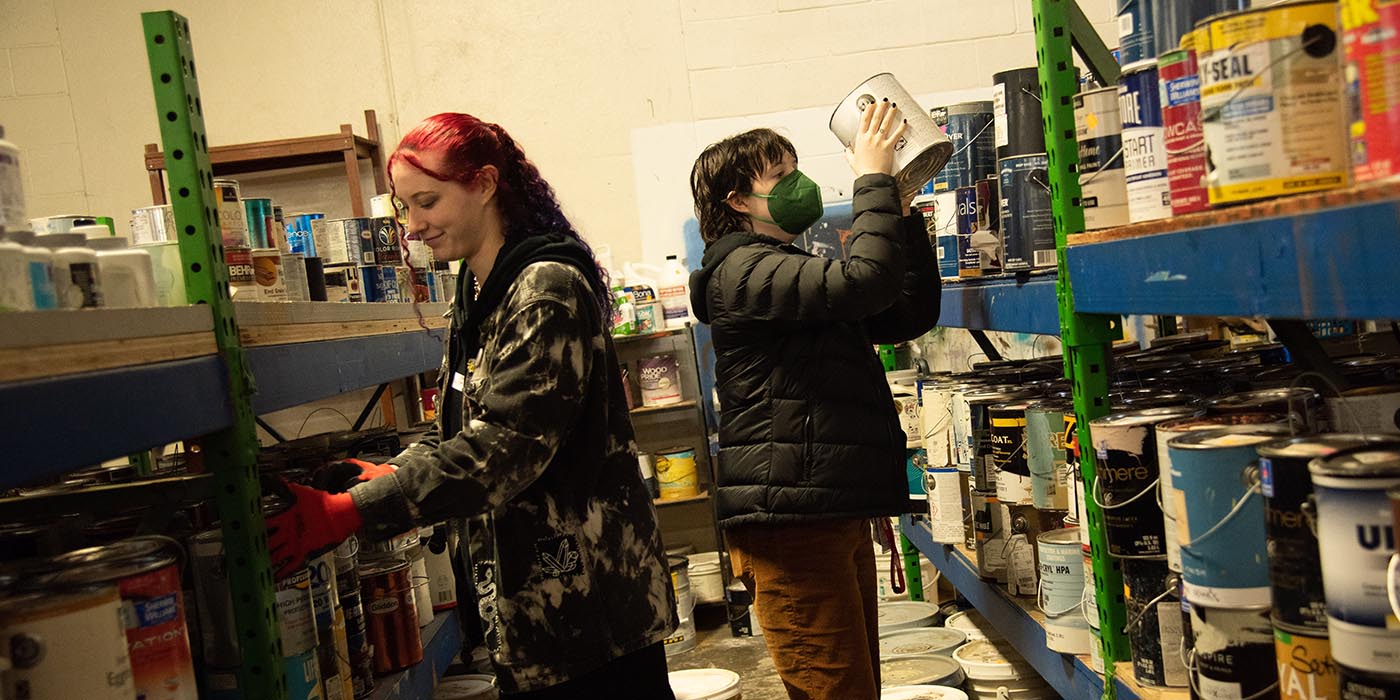 Students putting things on shelves